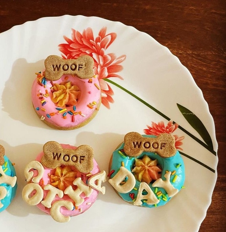 WOOF doughnuts spelling Happy Birthday